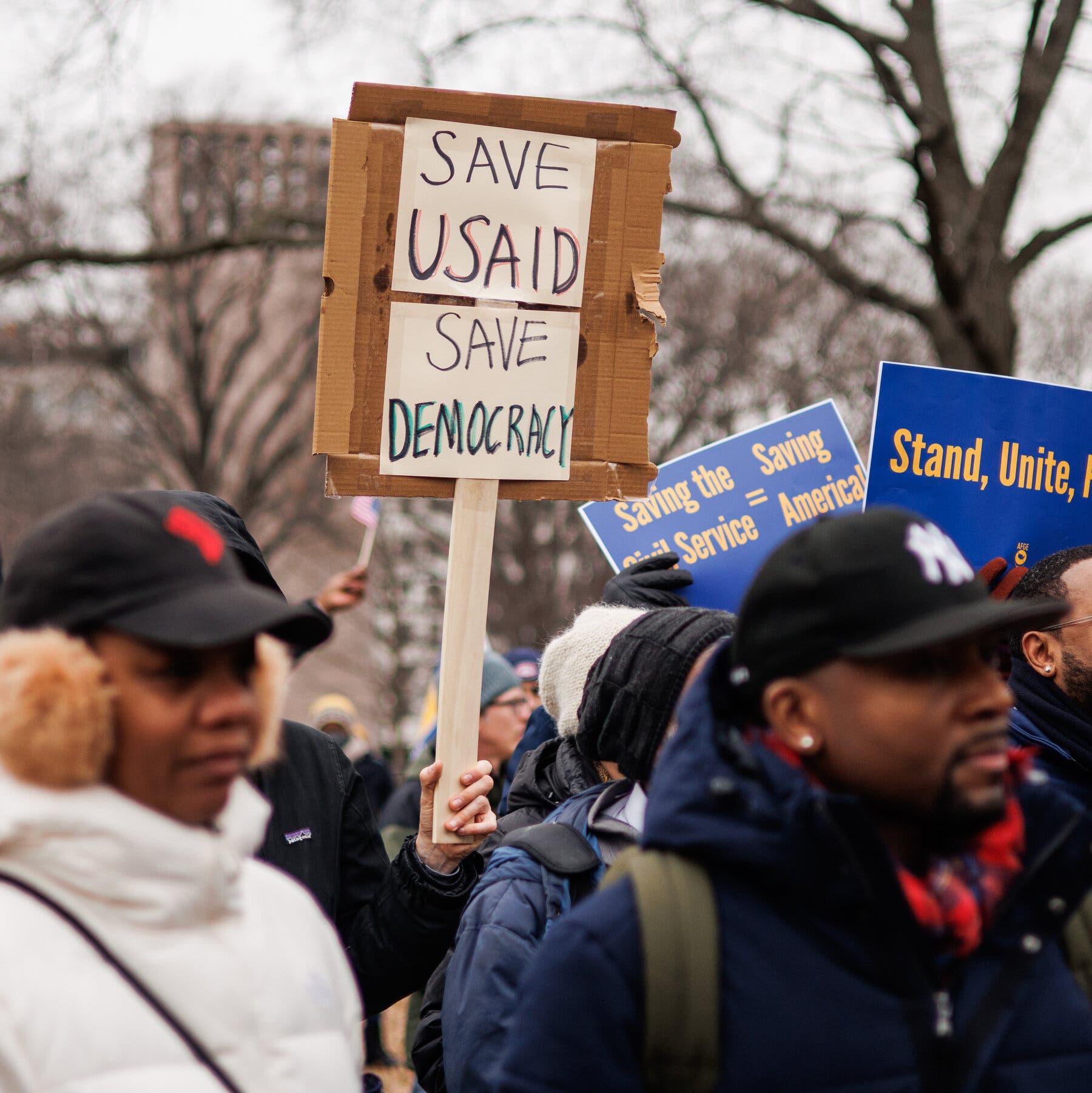 00pol-dems-status-quo03-photo-ctqv-mobileMasterAt3x¡.jpg|Federal employees in February holding up signs and protesting government cuts by the Trump administration. 