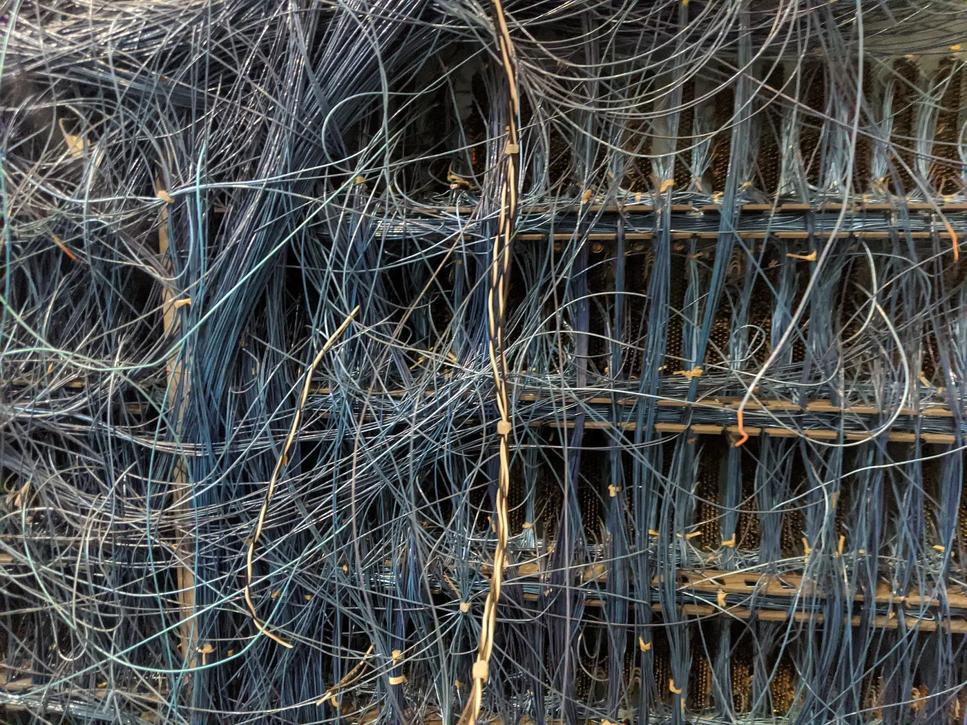 2026-04-16 ¡hand-wired backplane.jpgThe complex, hand-wired backplane of an electromechanical supercomputer at the Computer History Museum boneyard; it is an impossible tangle of wires joining various subassemblies.