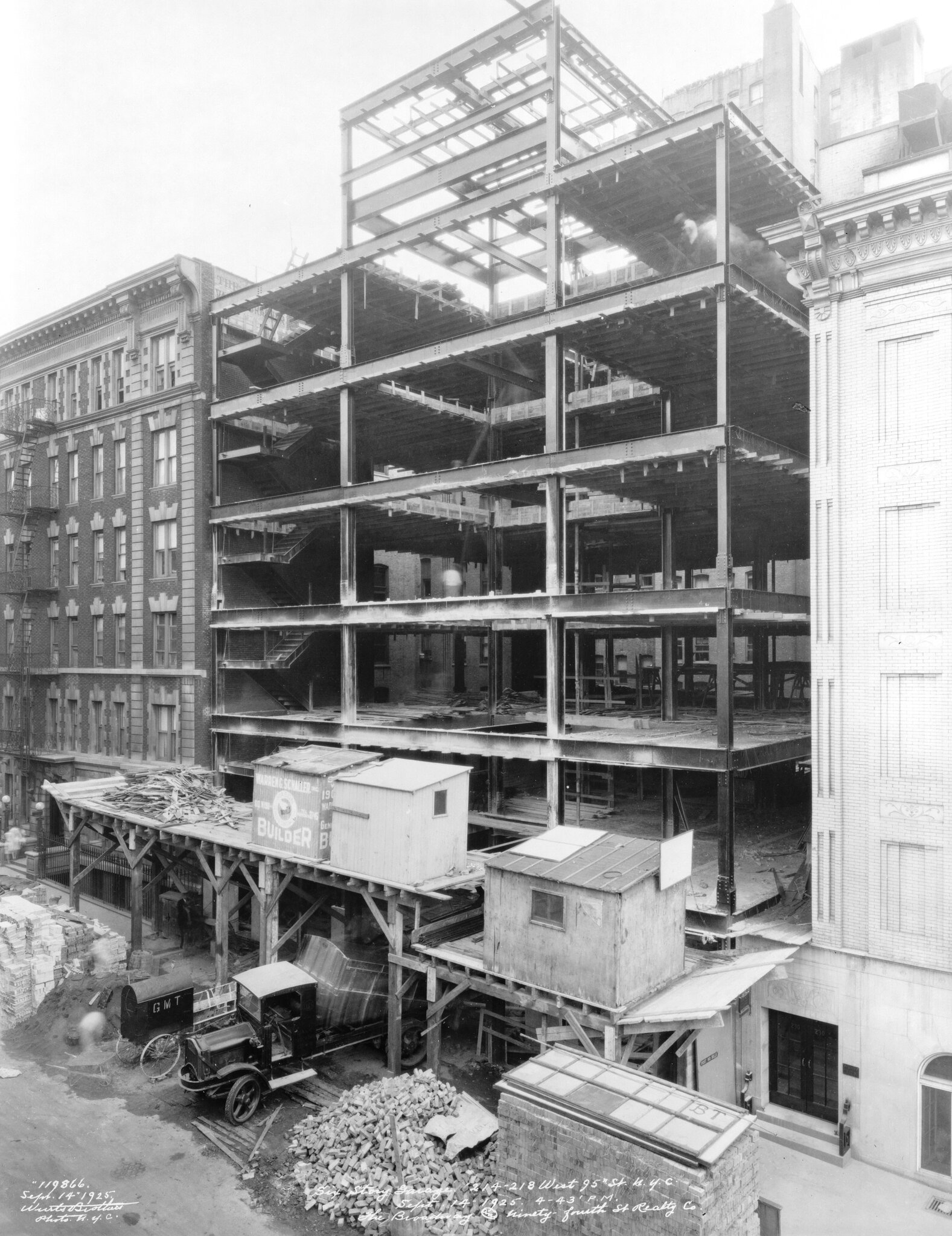 2026-06-10 ¡parking-timeline-03-fgwb-superJumbo-v2.jpgA black-and-white photo from about 1925 of a building under construction about seven stories high.